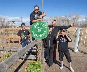 Picture of people standing in a community garden